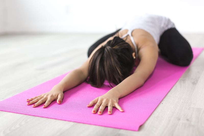 Woman practicing Pilates